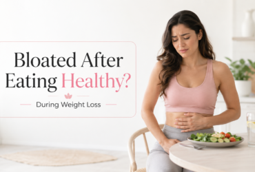 woman feeling bloated after eating healthy during weight loss